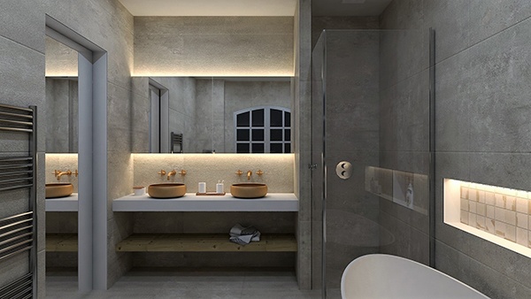 deux vasques dorées sur un plan blanc dans une salle de bains en béton ciré