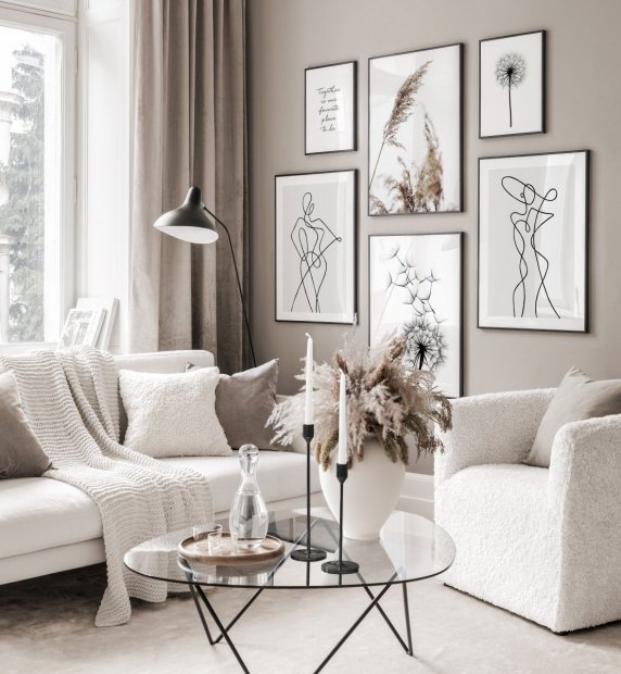 salon scandinave avec mobilier cosy blanc et line art au mur