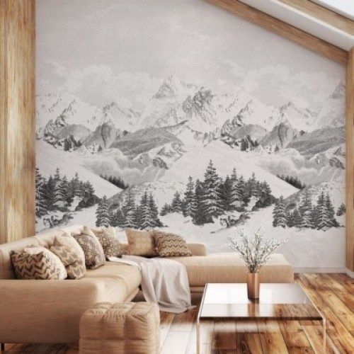 canapé d'angle en cuir dans salon déco chalet avec papier peint à motif montagnes enneigées