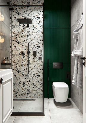zellige dans la douche et sol en carreaux de béton dans une salle de bains moderne