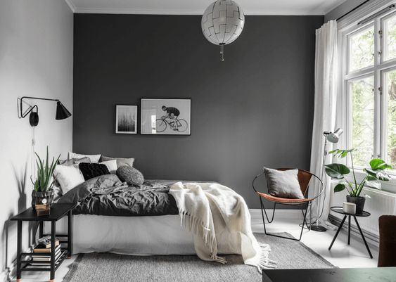 mobilier design et murs gris et blancs pour une déco chambre moderne