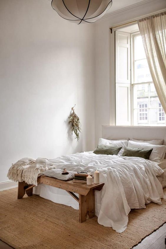 chambre slow design avec draps de lit et coussins en matières organiques