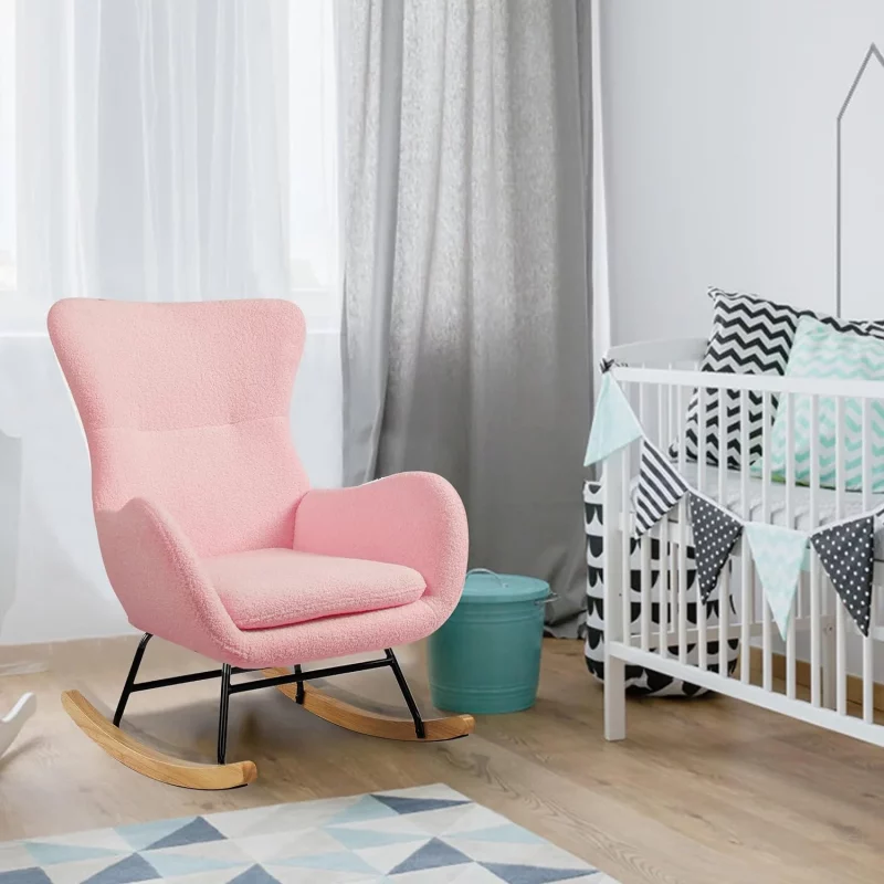 Un fauteuil rose à bascule de style scandinave dans la chambre bébé