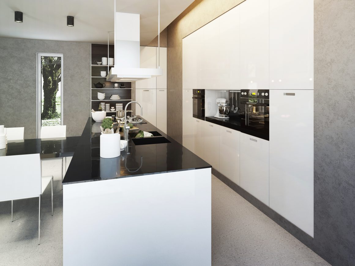 Cuisine moderne incluant plans noirs, armoires blanches brillantes, éclairage naturel et décor épuré.