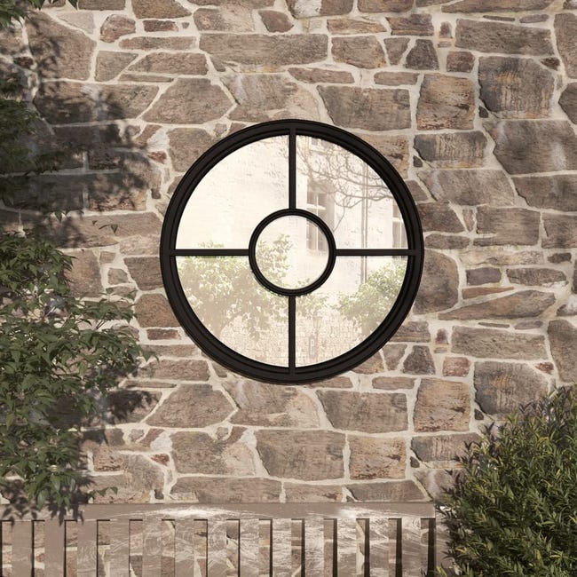 Mur extérieur en pierre incluant un miroir