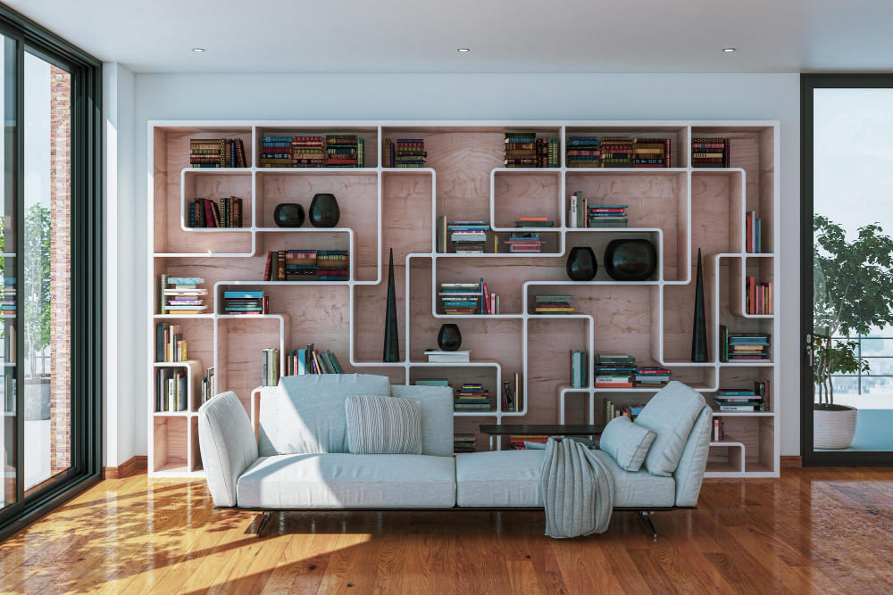 tendance déco 2026 avec des bibliothèques aux formes modulables dans un grand salon derrière le canapé