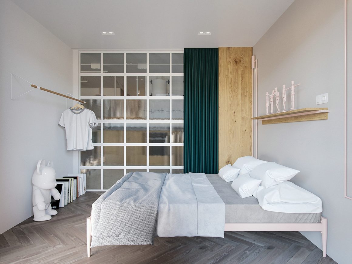 Chambre minimaliste aux tons neutres avec lit simple, rideau vert, paravent vitré et sol chevron