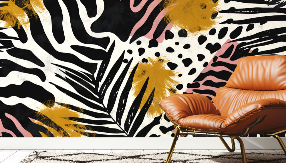 du papier peint tendance 2026 avec des motifs jungle noirs, blancs et orange, derrière un fauteuil en cuir