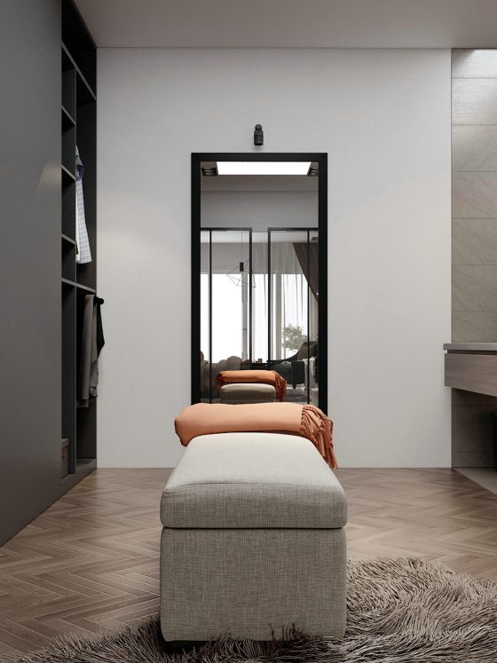 Aménagement dressing sur mesure avec penderies ouvertes, tiroirs, miroir, banquette et éclairage doux