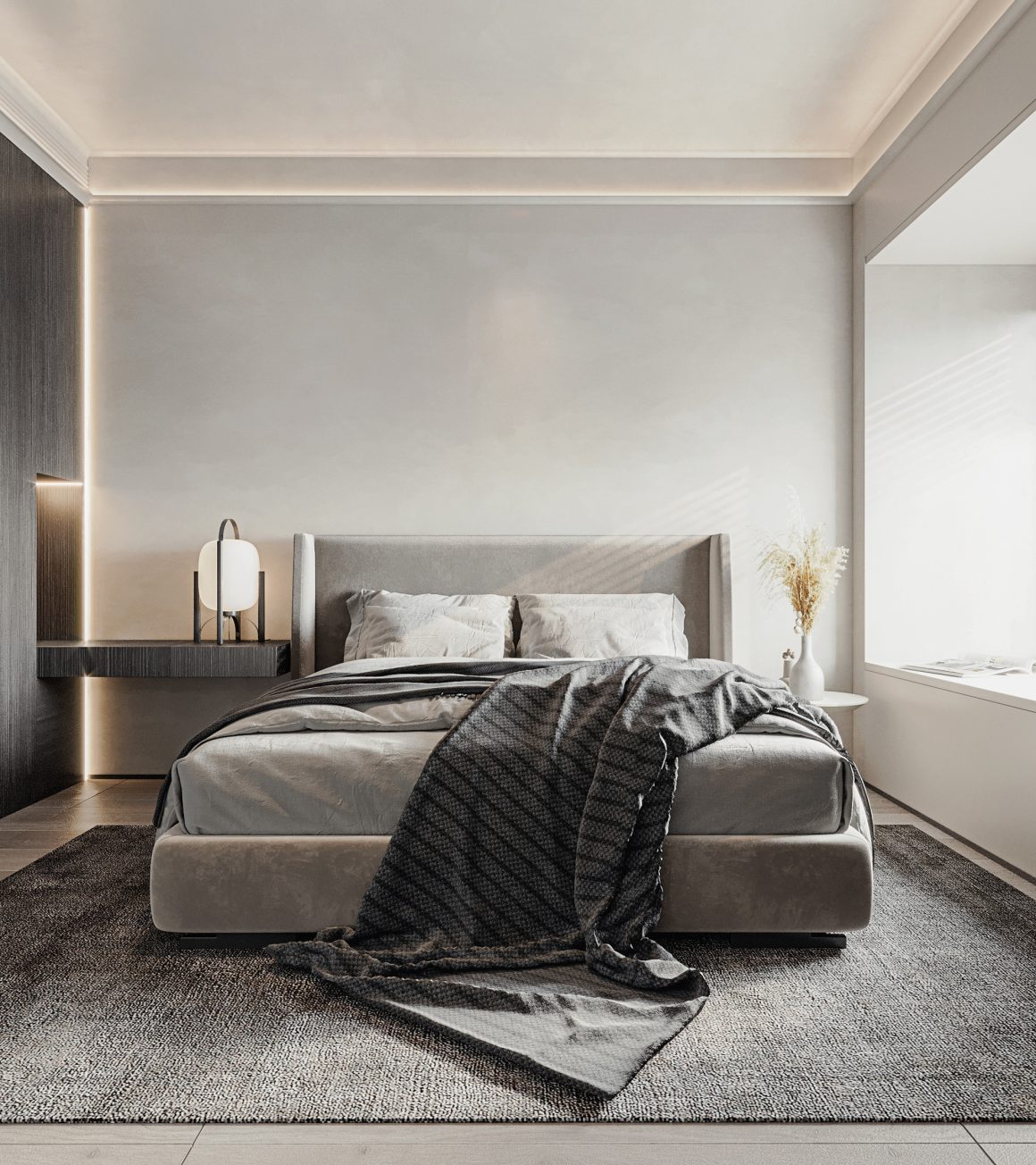 Chambre avec lit rembourré, éclairage d’ambiance, couverture sombre drapée, table basse et grand tapis doux.