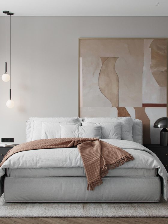 Chambre aux tons neutres incluant lit cosy, table de chevet noire et œuvre murale abstraite