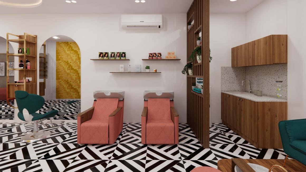 Institut de beauté aménagé avec fauteuils roses, carrelage géométrique noir et blanc, séparations en bois, coin lavabo et plantes.