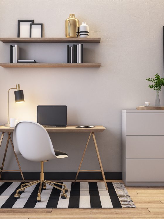 Espace de travail moderne avec chaise blanche, bureau en bois, lampe, étagères, commode grise et tapis