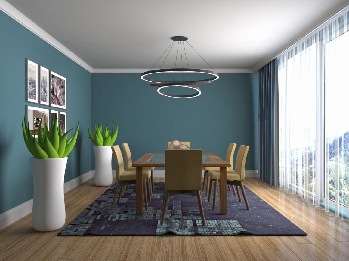 salle a manger dont le plafond est peint en blanc et les murs en bleue foncee, pour donner une impression de largeur