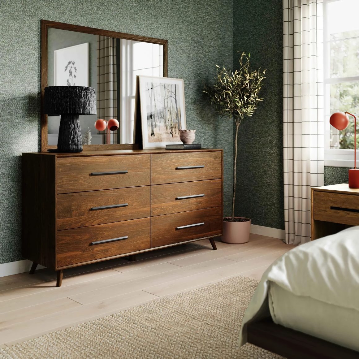 Décoration d'une commode en bois avec miroir, lampe noire texturée et tableau