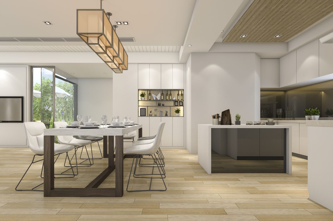 Cuisine ouverte sur salon manger incluant îlot minimaliste, grande table en bois, chaises blanches et éclairage suspendu