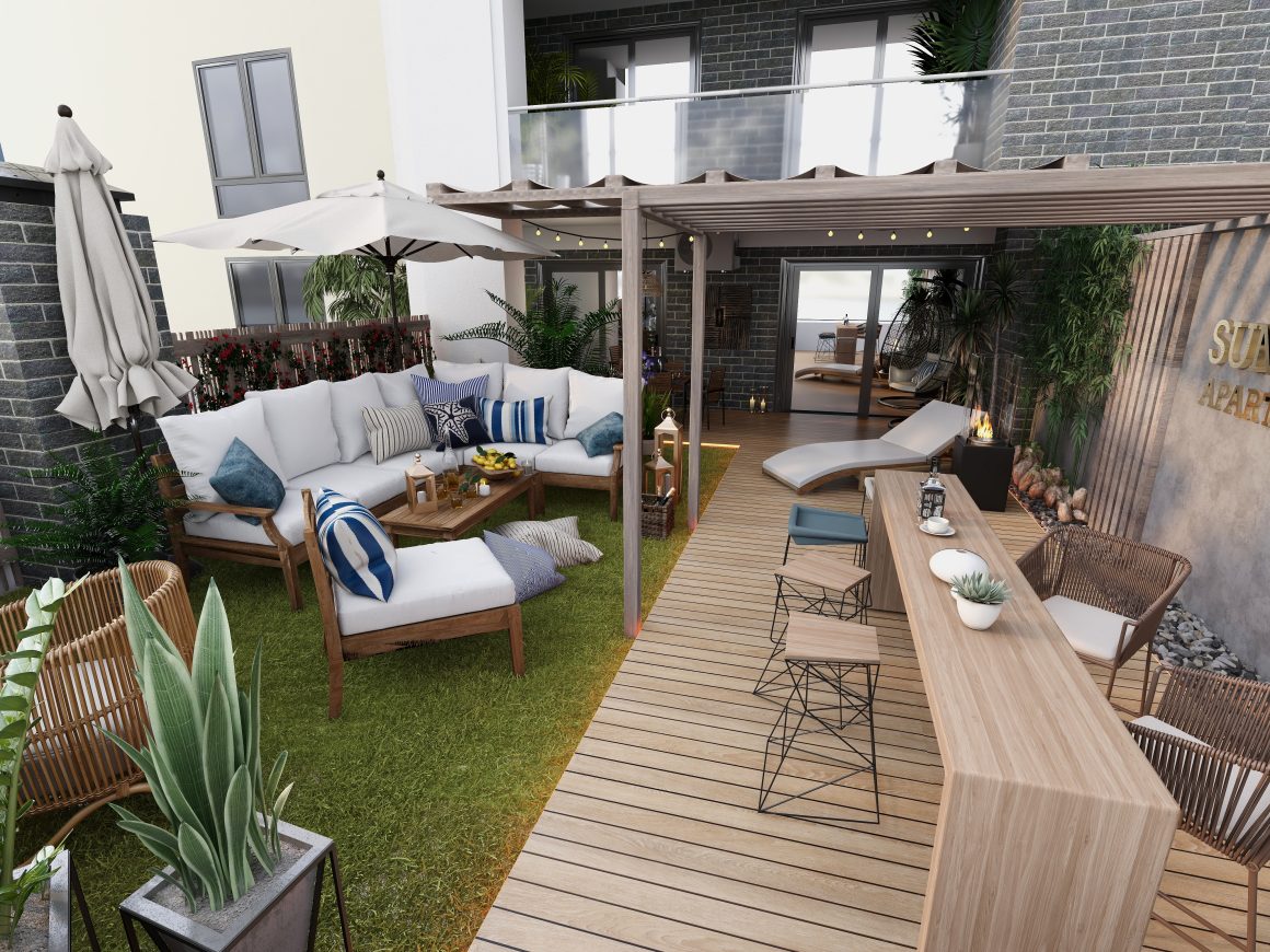 Terrasse aménagée avec pergola, salon, bar en bois, chaises longues, plantes et guirlandes