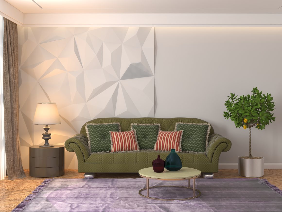 Canapé vert vintage avec coussins à motifs, lampe, mur texturé géométrique, table basse et tapis