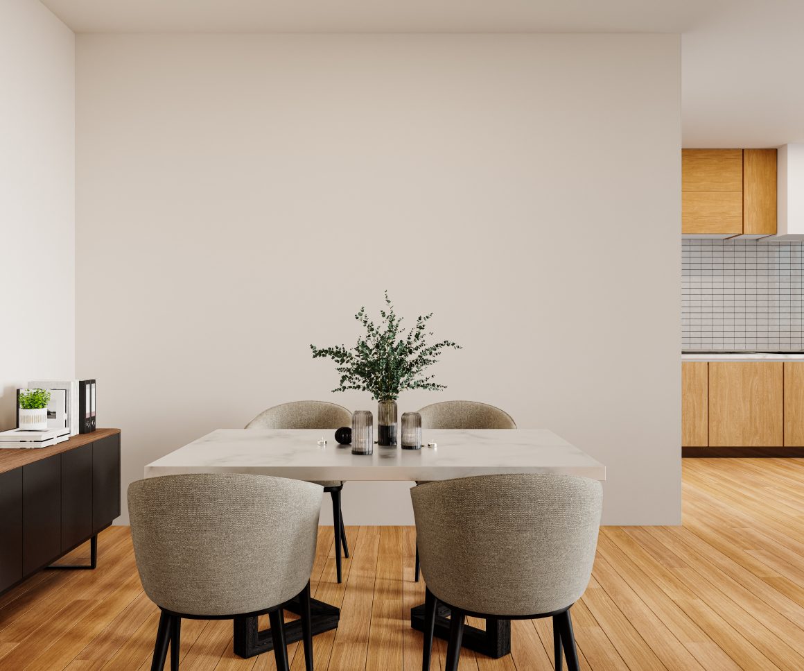 Table à manger blanche avec quatre fauteuils gris, et buffet sombre
