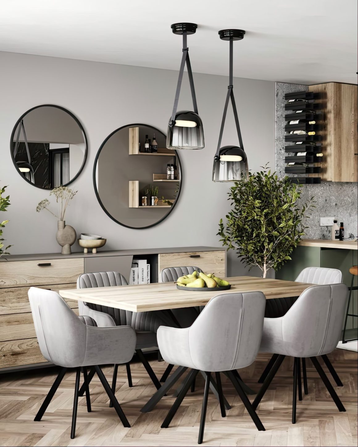 Table à manger en bois clair avec chaises gris en velours, miroirs ronds et suspensions