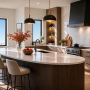 Cuisine tendance 2027 : îlot ovale en bois avec surface en marbre, luminaires suspendus et étagères en bois