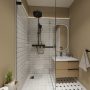 Petite salle de bain beige avec douche à l'italienne vitrée, meuble vasque flottant et éclairage doux