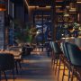 Déco bar restaurant chaleureux avec éclairage tamisé et plantes