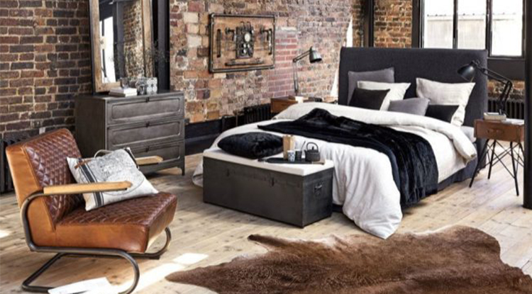 industrial-style-bedroom-with-red-tiles-and-leather-chair